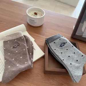 Autumn cute polka dot bow embroidered mid-tube socks for women, stylish college style.