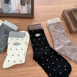 Fall new polka dot embroidered bow mid-calf socks detailed view featuring cozy cotton knit.