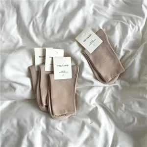 Detail view of warm-toned long-staple cotton mid-calf women socks, soft and comfortable.