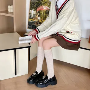 Korean style solid color knee high socks for women, comfortable autumn winter daily wear.