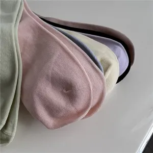 Comfortable ribbed cotton mid-calf socks in warm pastel colors, soft loose cuff design.