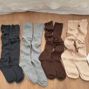 Cozy solid color slouch socks for women, warm knit long tube socks for winter daily wear.