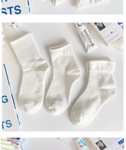 White cotton socks detail view, soft and breathable mid-tube design for women spring style.