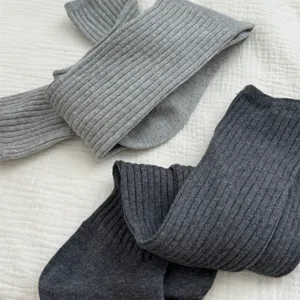 Grey and dark grey long ribbed knit stack socks, detailed winter warm hosiery display.