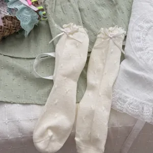 Sweet cute ruffle bow polka dot cotton mid-calf socks for women, breathable daily wear.