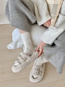Close-up detail of women's warm white ribbed slouch socks, soft knitted daily wear.