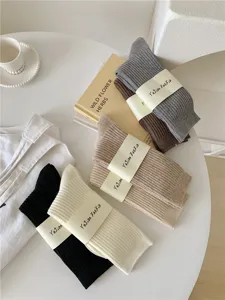 Detailed view of women's vintage ribbed wool crew socks in multiple autumn colors.