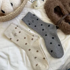Women's winter thick warm wool socks with cute polka dots and bow embroidery, cozy slouchy design.