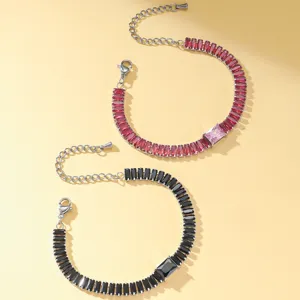 Detailed close-up of stylish rectangular cubic zirconia bracelets in red and black colors.