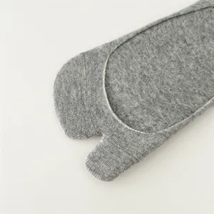 Close-up detail view of grey cotton split toe tabi invisible socks showing knit texture.