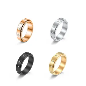 Stainless steel spinner ring featuring star and moon motifs with sparkling zircon stones.