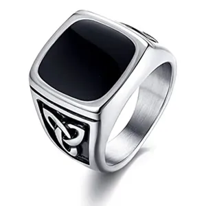 Stainless steel mens signet ring with black inlay and Celtic knot detail detail shot.