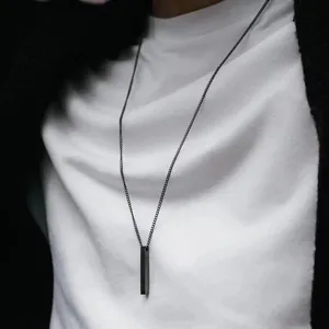 Minimalist black bar pendant necklace for men and women, chic titanium steel geometric jewelry.