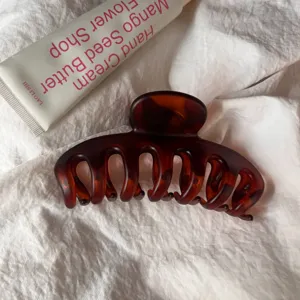Large brown tortoiseshell hair claw clip, hollow keel design for daily elegant styling detail.