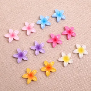 Colorful resin plumeria flower charms for DIY earrings, hair clips, and phone cases.