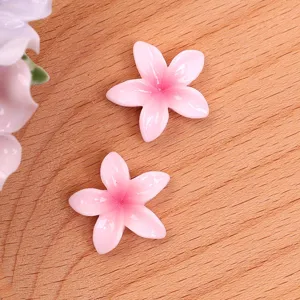 Resin plumeria flower DIY charm accessory for cute earrings, hair clips and shoe decorations.