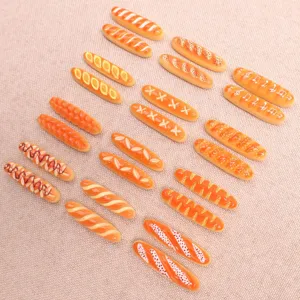Mini resin baguette bread charms for DIY hair clips, phone cases, and accessories.