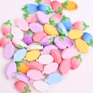 Detail view of colorful cartoon 3D tulip resin flower charms for DIY phone case and hair accessories.