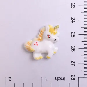Resin unicorn charm detail view, flatback design for DIY crafts, phone case decoration.