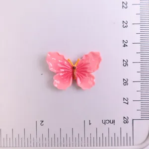 Pink resin butterfly charm DIY accessory for phone case and hair clips, cute glossy decor.