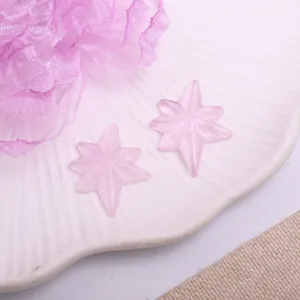 Pink sparkly star DIY hair accessory patch close up view, cute craft charm for girl crafts.