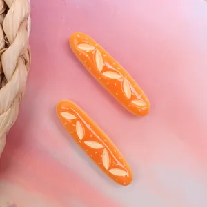 Resin baguette bread charm detail shot, perfect for DIY hair clips, phone cases and accessories.