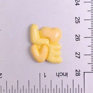 Glossy yellow LOVE resin charm for DIY hair clips, phone cases, and handmade jewelry.