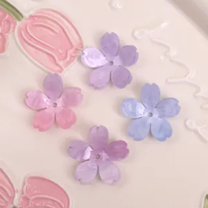Vista dettagliata di accessori per gioielli DIY in acetato con glitter cinque petali.