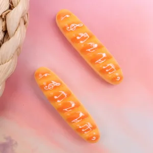Resin baguette charms with musical notes for DIY hair clips, phone cases and accessories.
