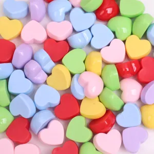Close-up detail shot of colorful resin heart cabochons, perfect for DIY phone case crafts.