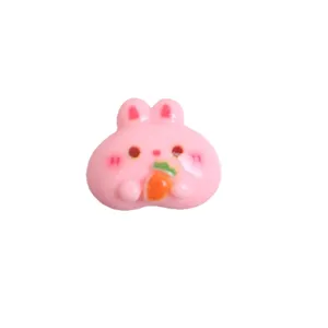 Cute pink rabbit resin flatback charm holding carrot, perfect for DIY hair clips and phone cases.