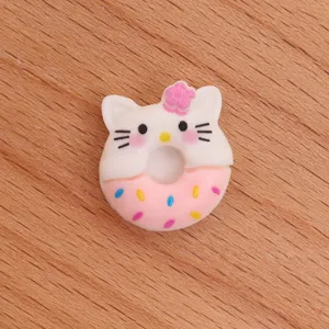 Close-up detail of a cute cat donut resin charm, perfect for DIY phone case decoration.