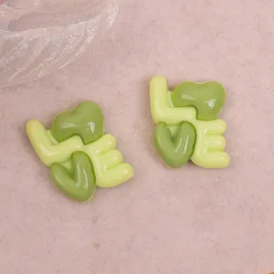 Glossy green heart resin DIY charm detail, perfect for phone cases, hair clips and handmade crafts.