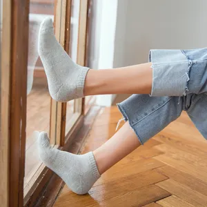 Close-up detail shot of breathable grey mesh ankle socks with towel bottom cushion design.