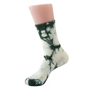 Closeup view of women's tie-dye crew socks with retro ink pattern, soft and comfortable.