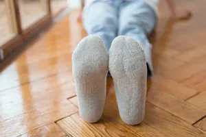 Grey towel sole detail of women socks showcasing thick loop cushion and cozy cotton fabric.