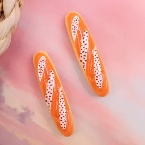 Miniature resin baguette bread cabochons for DIY phone case and hair clip accessories.
