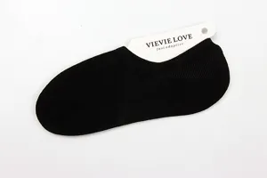 Detail view of women solid black low cut invisible boat socks, thin summer cotton anti slip.