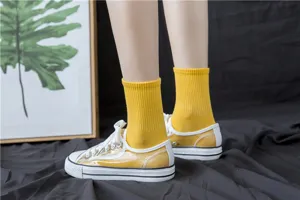 Comfortable yellow cotton mid-calf socks featuring soft ribbed design for women and girls daily wear.