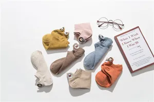 Detail view of women's cotton boat socks featuring cute dog embroidery, soft and breathable.