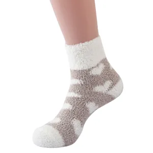 Cozy coral fleece fuzzy sleep socks with cute pattern for winter home wear and relaxing.