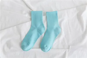 Detailed view of light blue cotton mid-calf socks, featuring ribbed design for casual wear.