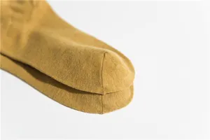 Mustard yellow cotton socks toe detail and close up view showing fine knit texture and quality