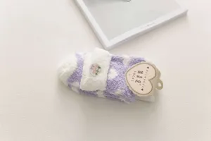 Cozy plush fuzzy socks detail view, soft coral fleece winter warm home sleep socks.