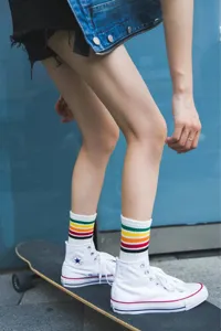 Women's striped mid-calf skate socks, colorful cotton sports socks for daily wear.