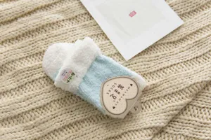 Cozy winter coral fleece slipper socks for women, warm plush fuzzy home floor socks.