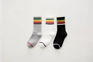 Detailed view of women casual striped mid-calf socks featuring colorful retro stripes.
