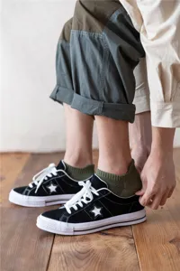 Green terry ankle socks detail showing thick towel bottom and comfortable fit for men active wear.