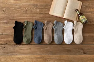 Detail view of thickened athletic towel-bottom men socks in multiple colors for outdoor.