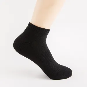 Detailed view of black athletic short socks featuring towel bottom mesh breathable design.